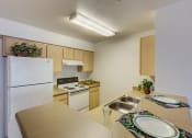 Thumbnail 11 of 19 - Kitchen at FOREST CREEK APARTMENTS, Spokane