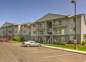 Thumbnail 3 of 19 - Building Exterior and Parking Lot at FOREST CREEK APARTMENTS, Spokane, WA 99208