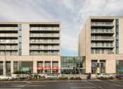 Thumbnail 5 of 5 - a view of two apartment buildings on a city street
