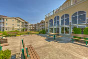 Thumbnail 5 of 17 - Community Building View  with Benches Chehalis, Wa Apts for rent l Vintage at Chehalis Senior Apartments 