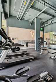 A gym with treadmills, weights, and exercise equipment.at 2221 S Western, California, 90018