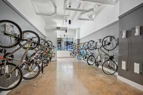 A bike rack with many bicycles parked.