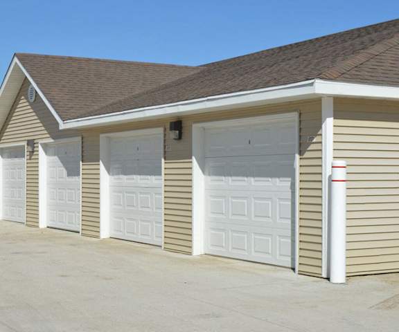 Vue 28 Individual Garages A row of light-yellow rentable garages at Vue 28 Apartment Homes.