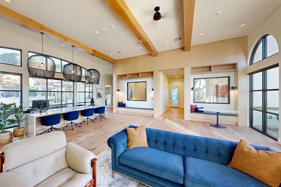 a large living room with a blue couch and a table with chairs at Anacapa Canyon, Camarillo, 93012