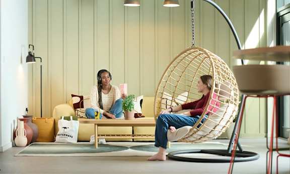 a living room filled with furniture and a large window