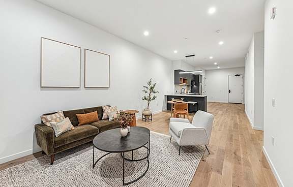 Bright and beautifully decorated living room at 701 Hudson, Los Angeles, California