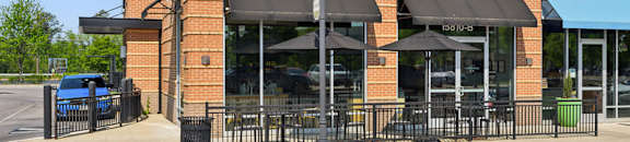 A Starbucks sign is on the front of a building.