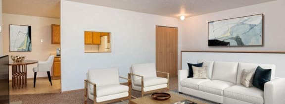 a living room with a couch and a coffee table. Fargo, ND Foxtail Creek Townhomes
