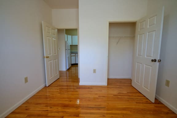 Bedroom with closet and entrance to hallway