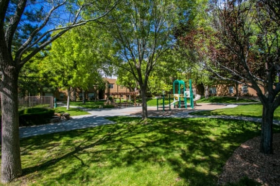 Santa Fe Apartments on Airport Road with Playground and BBQ Picnic Tables
