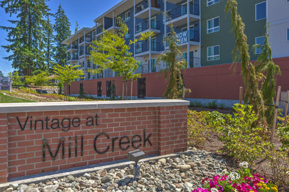 Community Building and sign Vintage at Mill Creek Senior Apartments in Mill Creek WA 98012