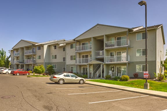 Building Exterior and Parking Lot at FOREST CREEK APARTMENTS, Spokane, WA 99208