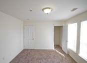 Thumbnail 4 of 8 - Bedroom with carpeted floors