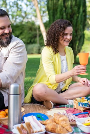 a family having a picnic in a park