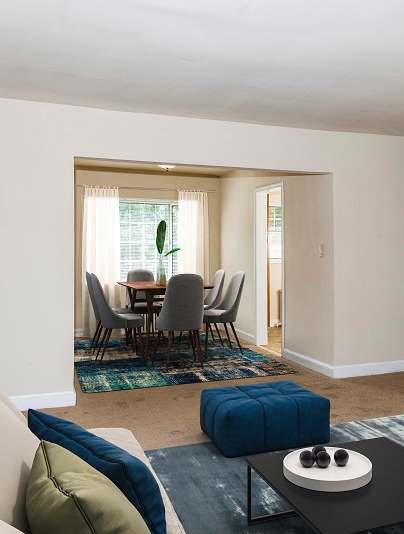 a living room with a couch and a coffee table at Hamilton Manor Apartments, Hyattsville, MD 20782
