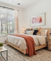 a room with a long table with green chairs and a large window with a view of a  at Link Apartments® NODA 36TH,North Carolina,28206