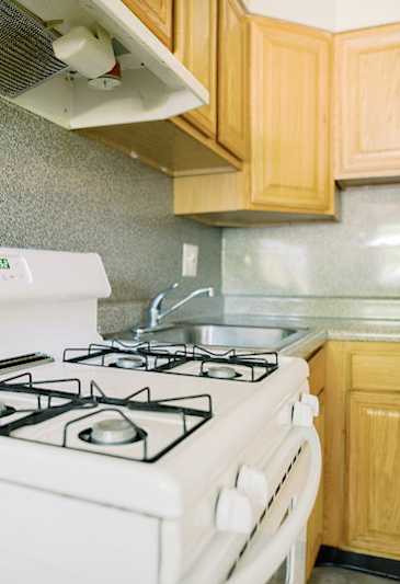 a kitchen with a stove and a sink at Krewstown Park Apartments, Philadelphia, PA 19115