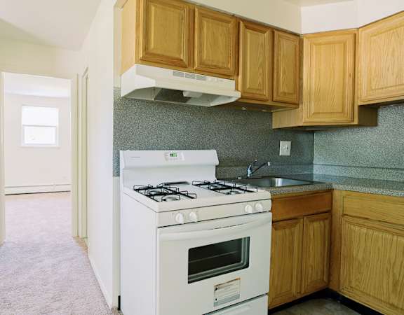 a kitchen with a stove and a sink at Krewstown Park Apartments, Philadelphia