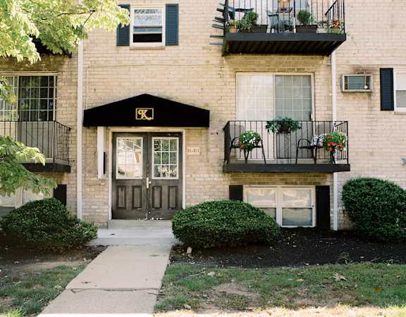 the front of a brick house with a sidewalk in front of it at Krewstown Park Apartments, Philadelphia