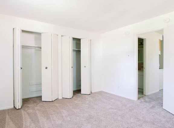 a room with three closets and a carpeted floor at Krewstown Park Apartments, Philadelphia, PA 19115