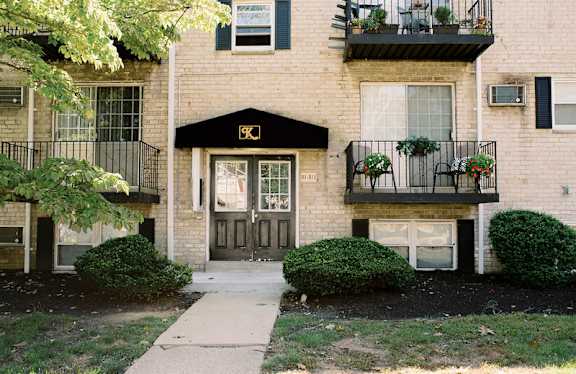 the front of a brick house with a sidewalk in front of it at Krewstown Park Apartments, Pennsylvania, 19115
