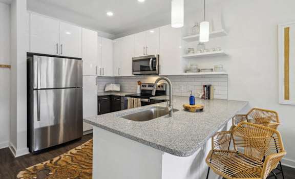 a kitchen with a counter top and a sink at Link Apartments® Broad Ave, Memphis, Tennessee
