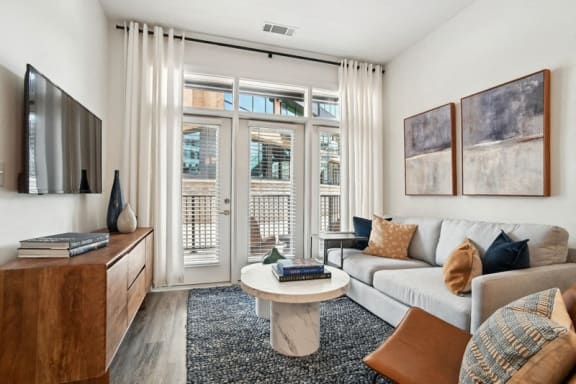 Clubhouse with fire place and TV  at Link Apartments® Montford, North Carolina, 28209