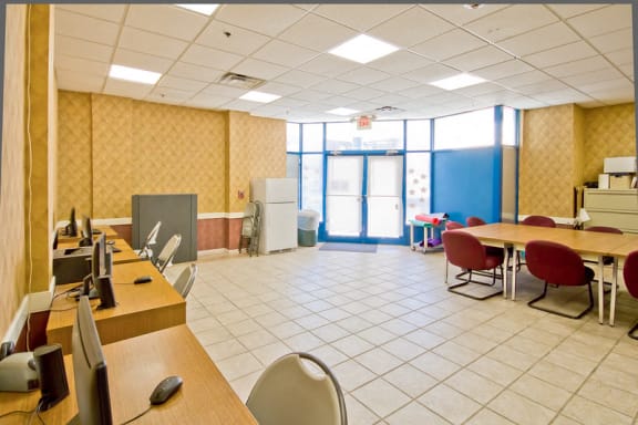 community room with lounge and desks with compueters