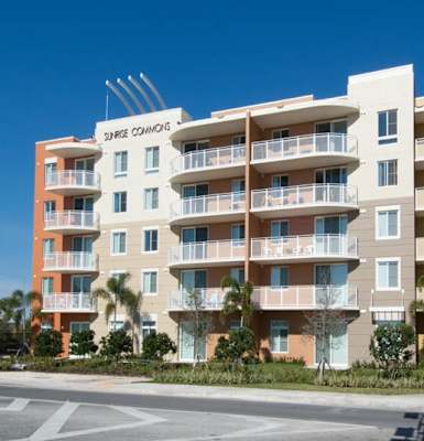 a large apartment building on the side of a street