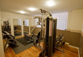 Gym/Fitness Center weight room with weight machines and dumbbells