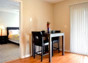 Thumbnail 20 of 22 - Apartment dining room with dining table seated for two