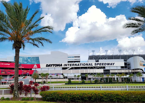 A large building with the words "Daytona International Speedway" on it.