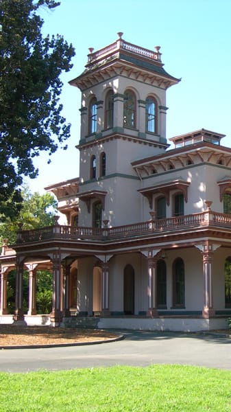 a large house with a tower on top of it