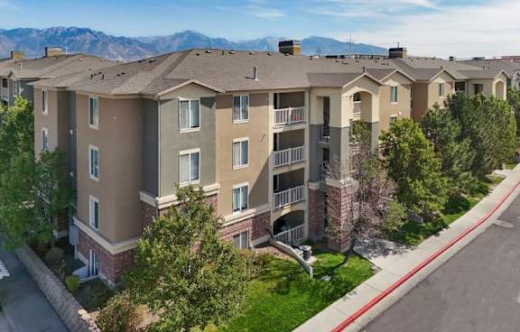 Apartment complex with a mountain range in the background.