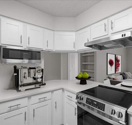 a white kitchen with a stove and a microwave