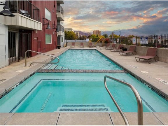 a swimming pool on the side of a building
