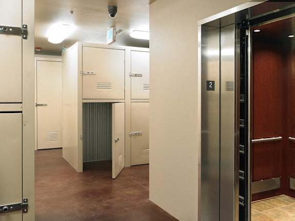 A hallway with a number 2 on the elevator door.