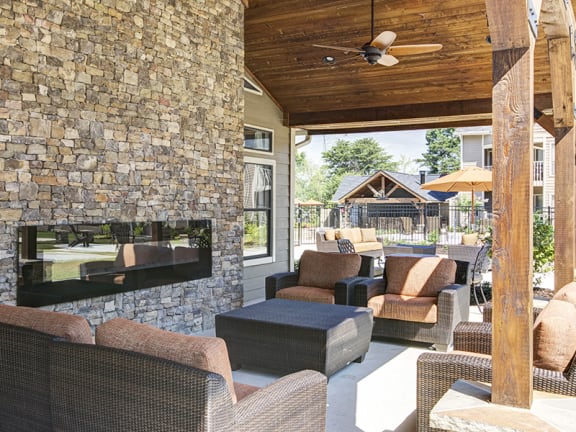 Poolside Seating and Fireplace at Duluth Apartments for Rent Near Highway 316