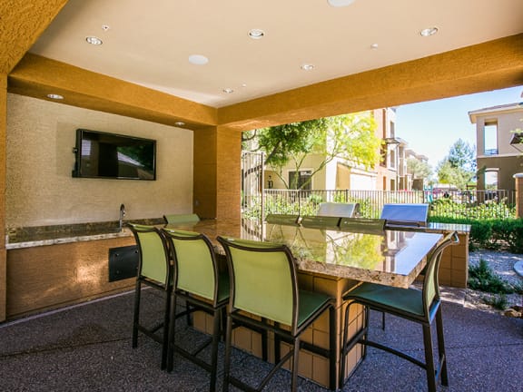 Outdoor Kitchen and Poolside BBQ at Mesa AZ Apartment Near Boeing