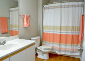 Thumbnail 17 of 22 - Bathroom with single vanity, toilet, and full bath