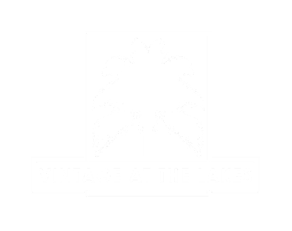 A black and white logo with a palm tree and the words "Vintage at the Lakes".