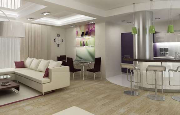 A living room with a grey chair and a wooden table.