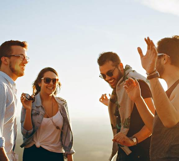 A group of students dancing outside together.