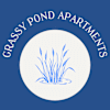 A logo for Grassy Pond Apartments featuring grass in a pond.