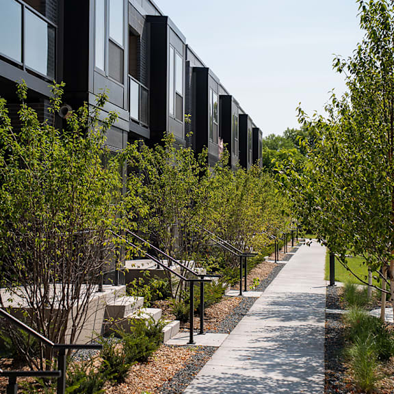 A modern building with a walkway in front of it.