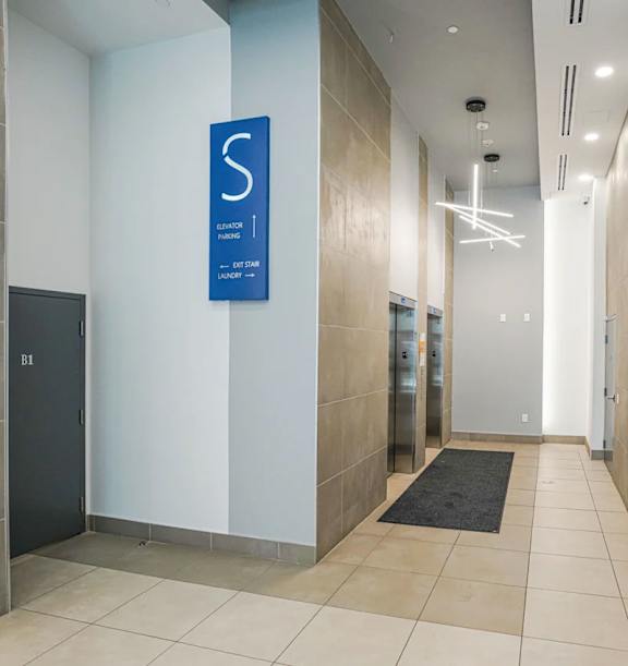 A hallway with a sign that says "Elevator 1" and "Do Not Enter".