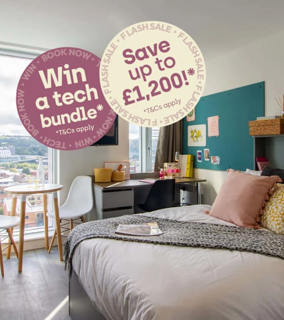 A bedroom with a bed, desk, and chair, with a sign offering savings on booking.