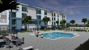 A group of people are sitting around a pool on a patio.