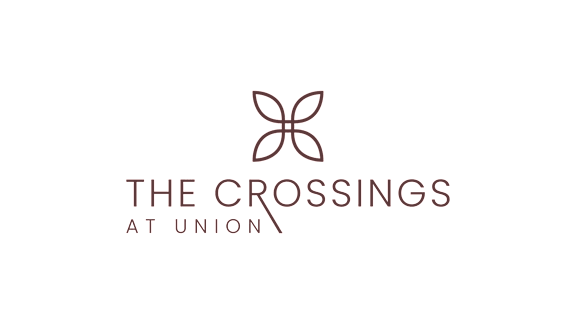 The logo for The Crossings at Union features a stylized butterfly.