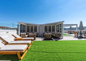 Thumbnail 11 of 42 - A sunny day at the outdoor seating area of a modern building. 605 Place Student Housing & Co-Living, St George Utah